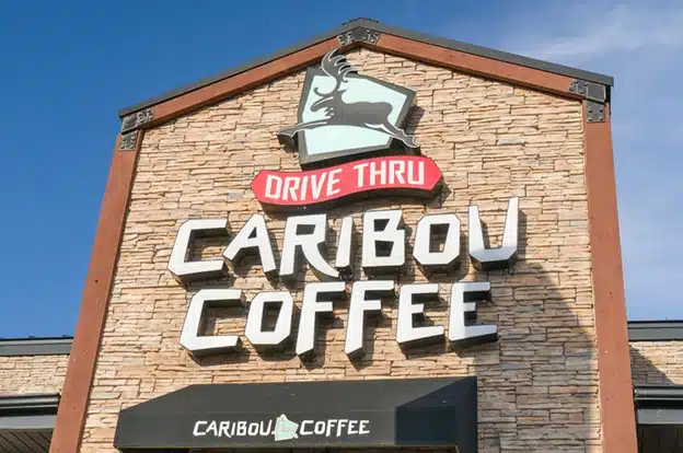 Bold commercial building signage with large lettering mounted on the exterior facade to boost visibility