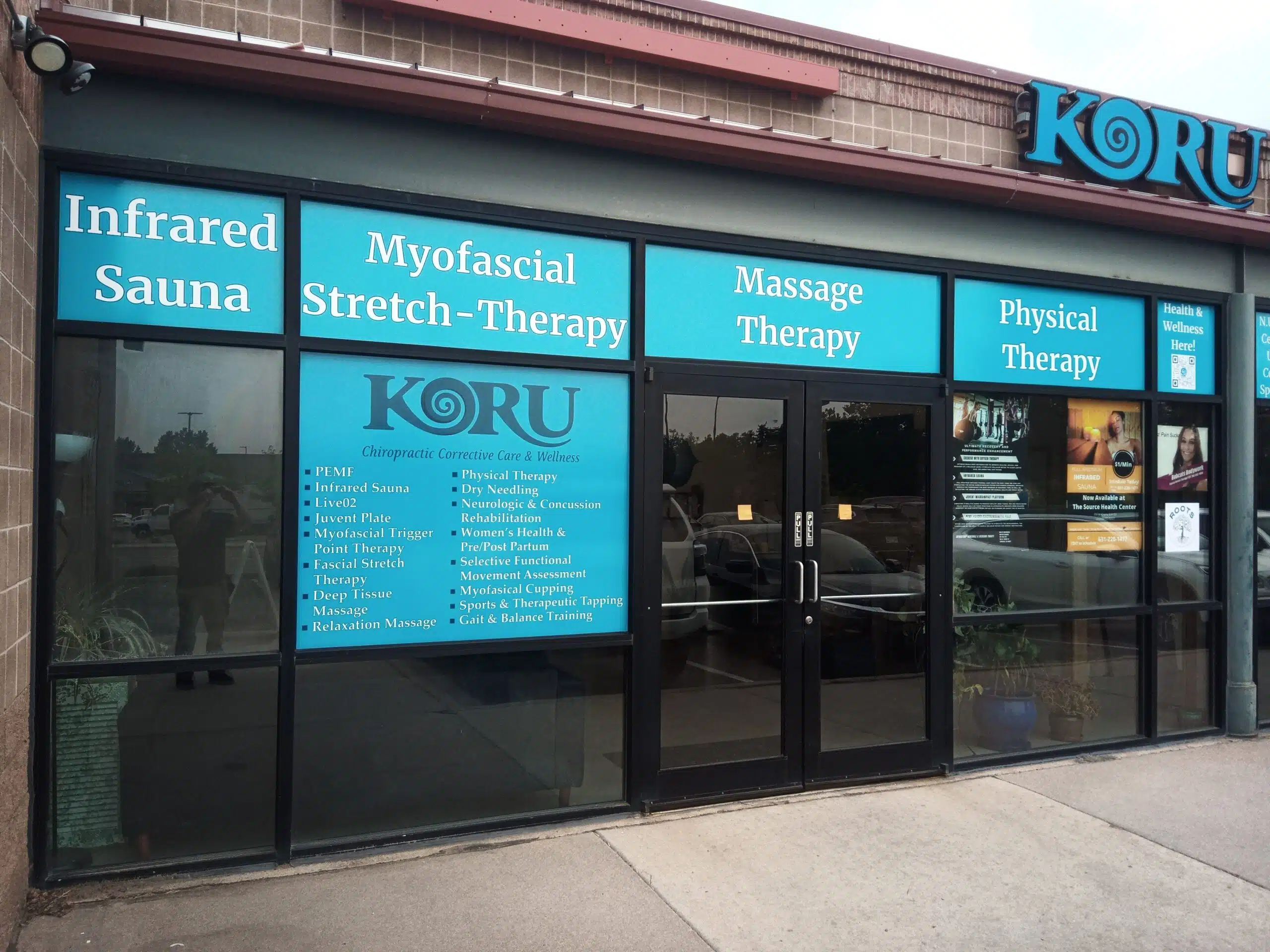 Professional custom vinyl signage on a business storefront, showcasing branding on glass windows