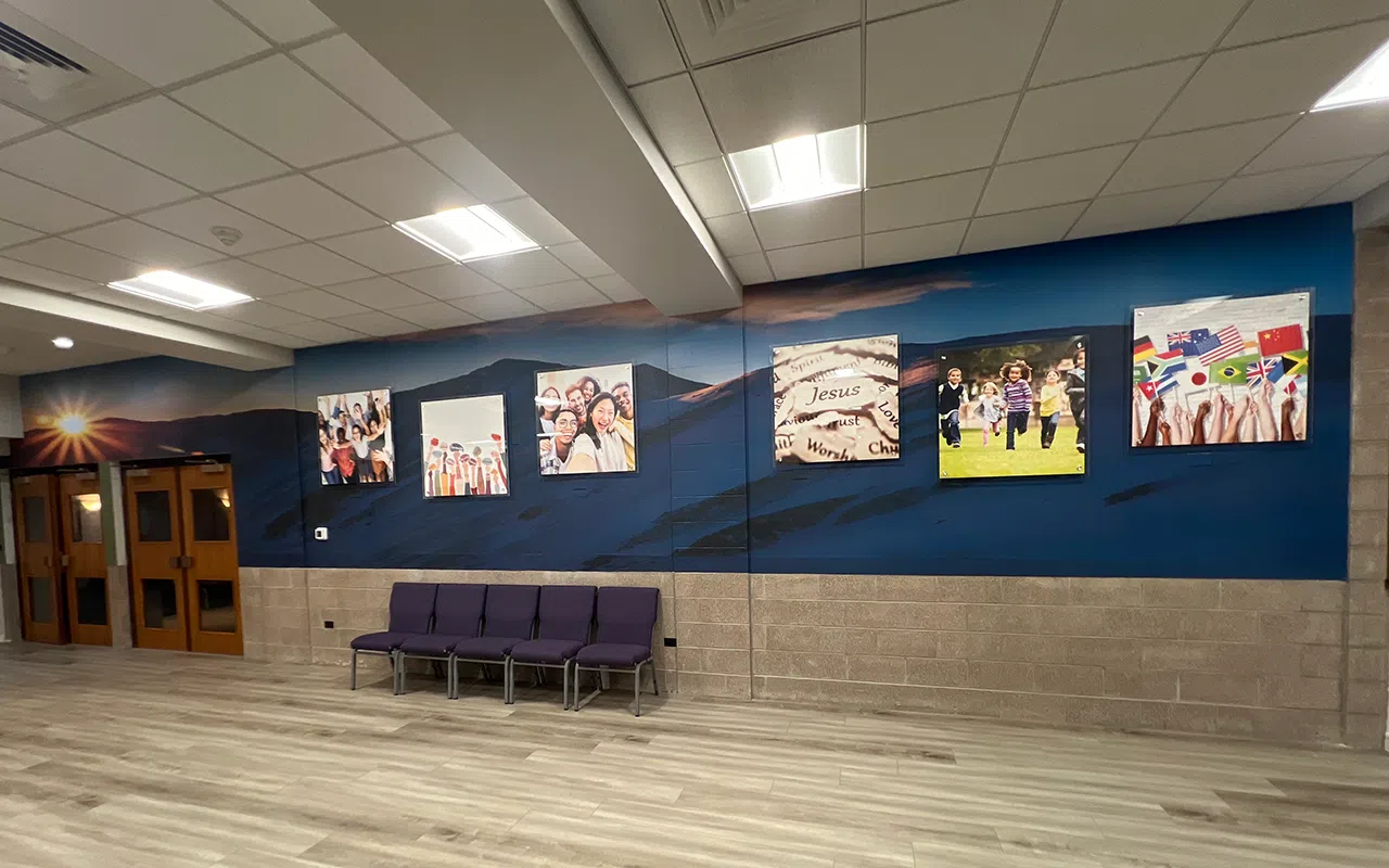 New Life lobby wall sign in a modern reception area, a polished indoor sign that reinforces brand presence