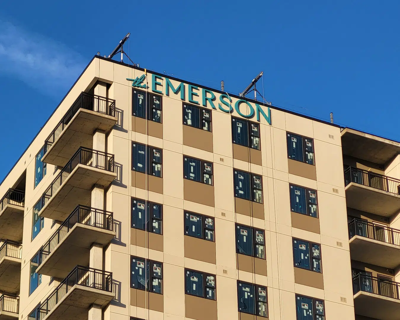 Emerson outdoor business sign mounted on building facade, professionally installed to code