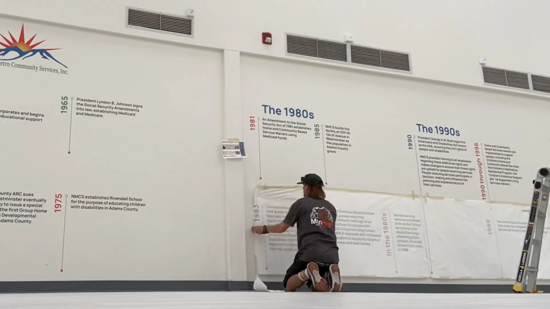 Technician installing a storefront sign, illustrating top installation mistakes and how to avoid them