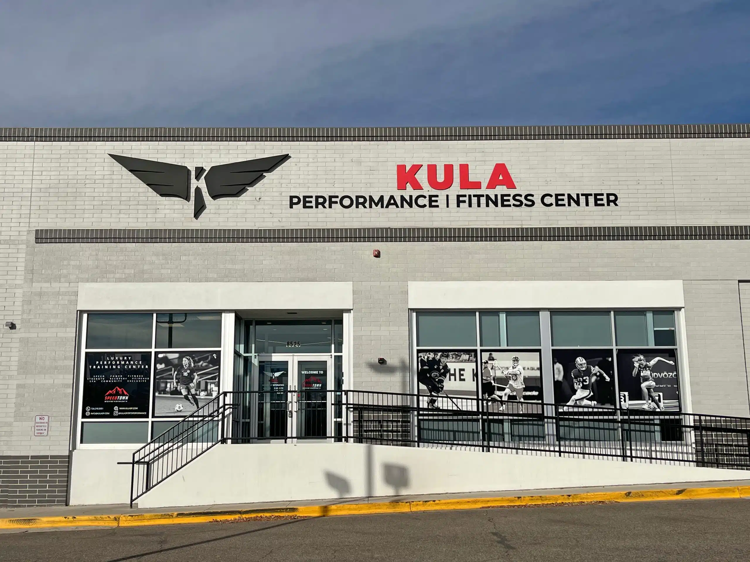 Kula exterior storefront sign installed on building facade, outdoor branding designed to increase local foot traffic