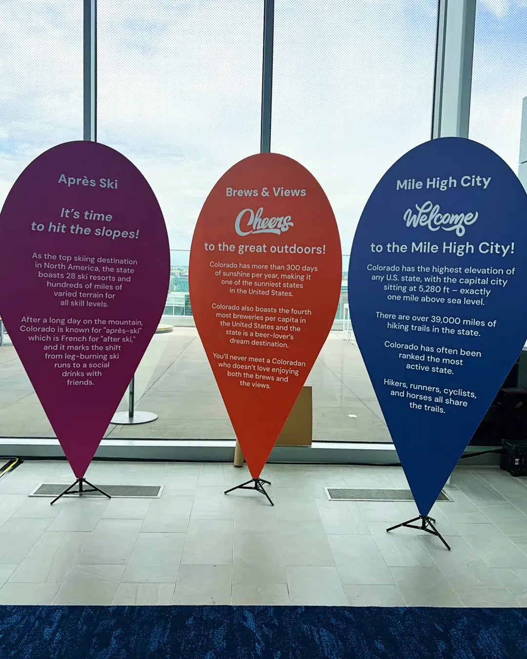 Trade show booth featuring branded retractable banners and signage to boost booth traffic and brand visibility
