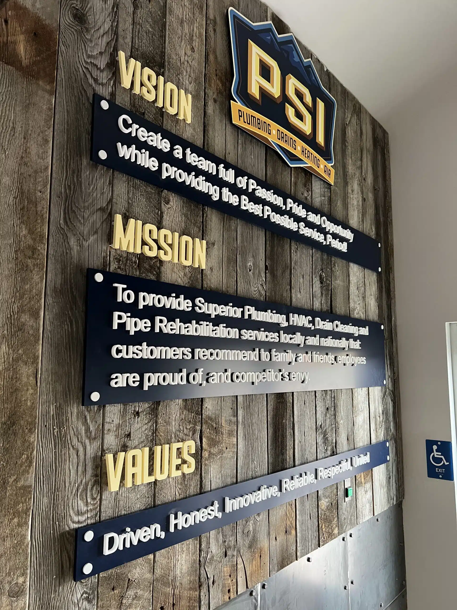 PSI office wall sign showcasing professional branding, enhancing cohesive identity in a modern workspace
