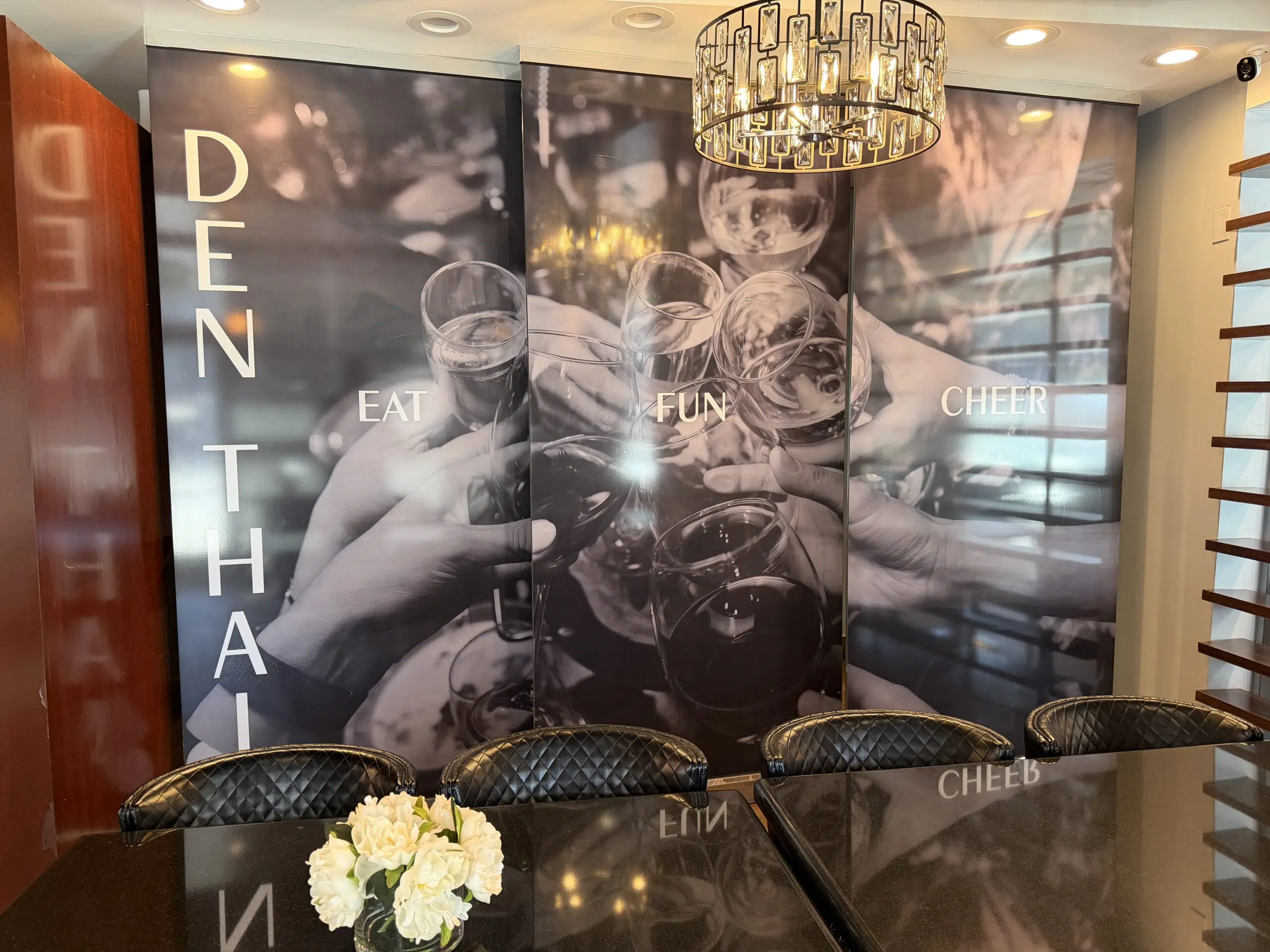 Large-scale custom wall mural with branded graphics transforming modern Denver office workspace