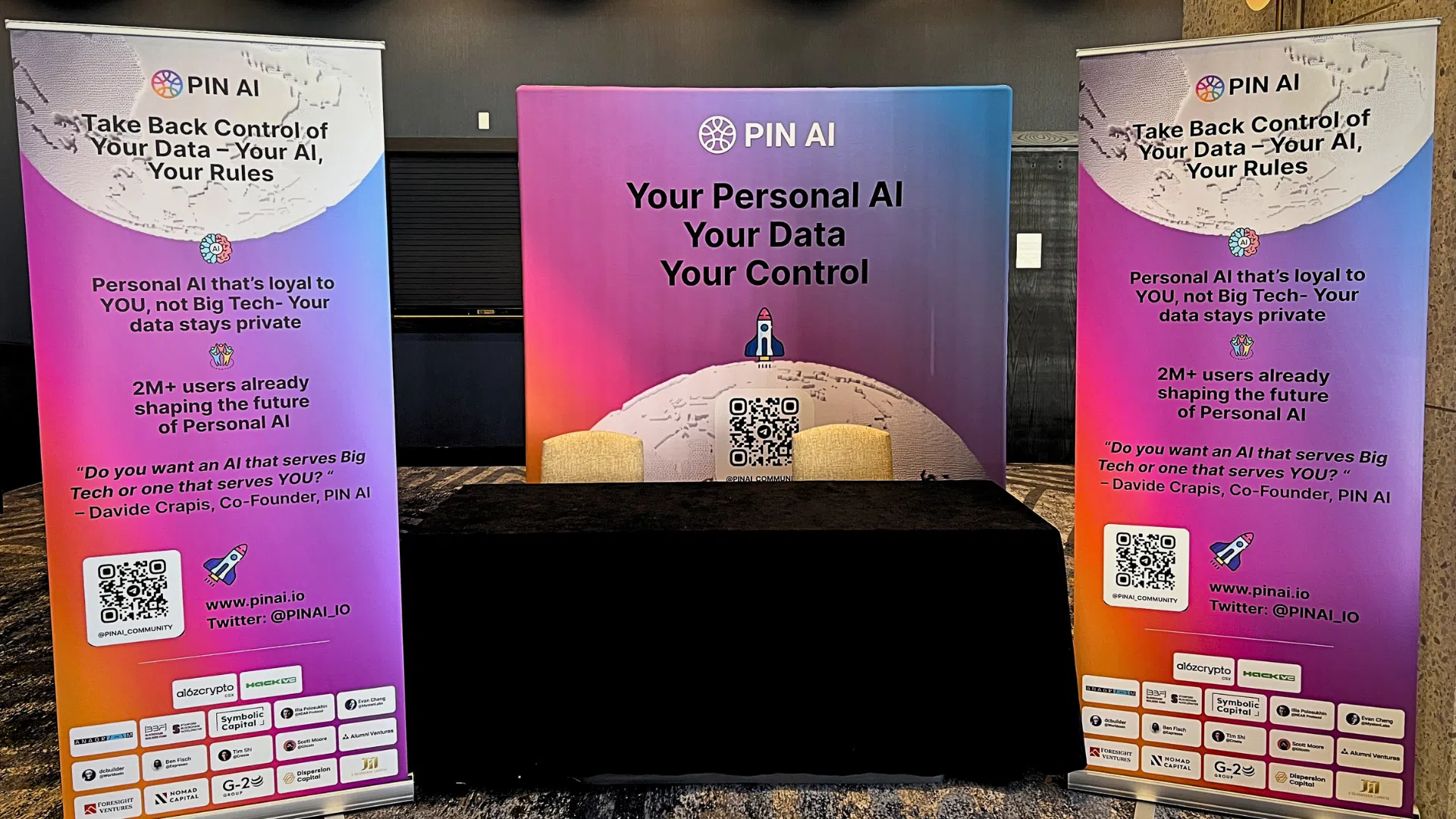 Custom trade show banner stands and branded backdrop display for PIN AI event booth setup.