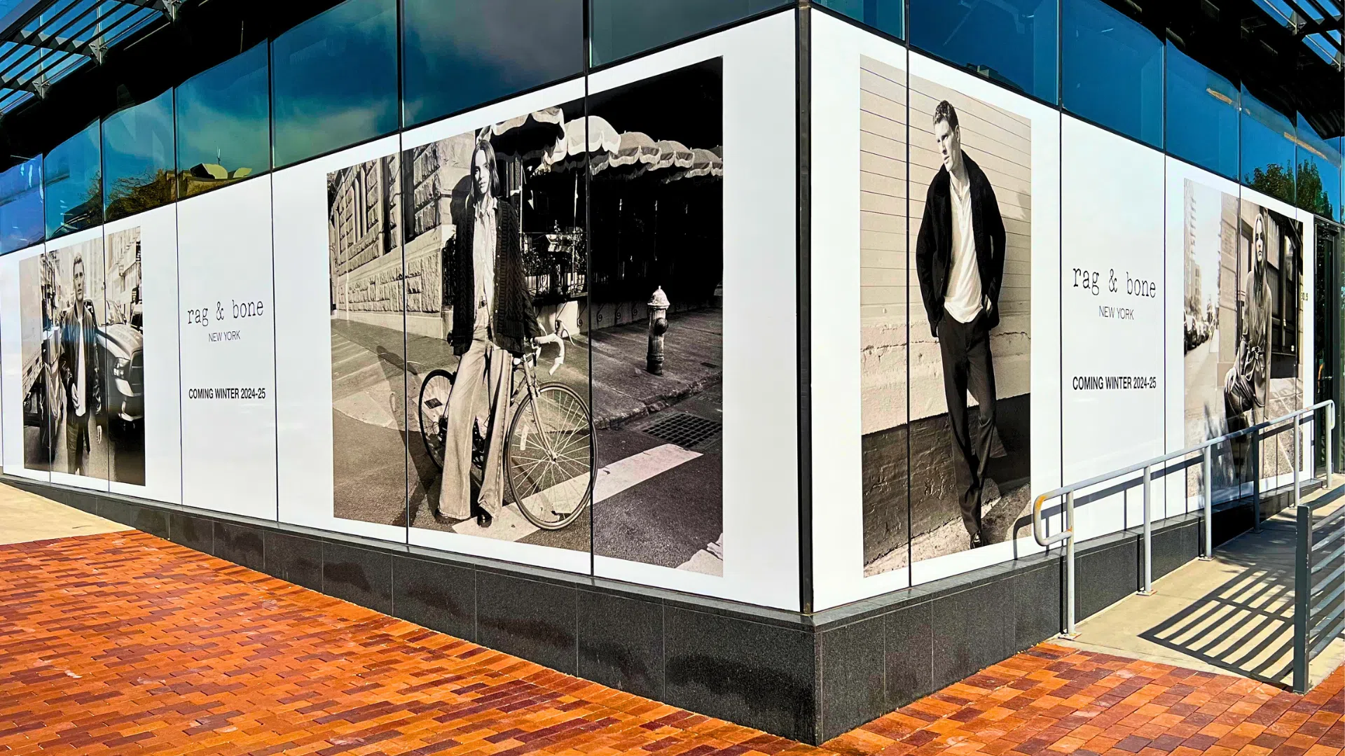 Large-format storefront window graphics installed for Rag & Bone retail location featuring fashion campaign imagery.