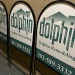 Custom A-frame sidewalk signs displayed outside a Denver business, designed to attract pedestrian traffic and increase local visibility.