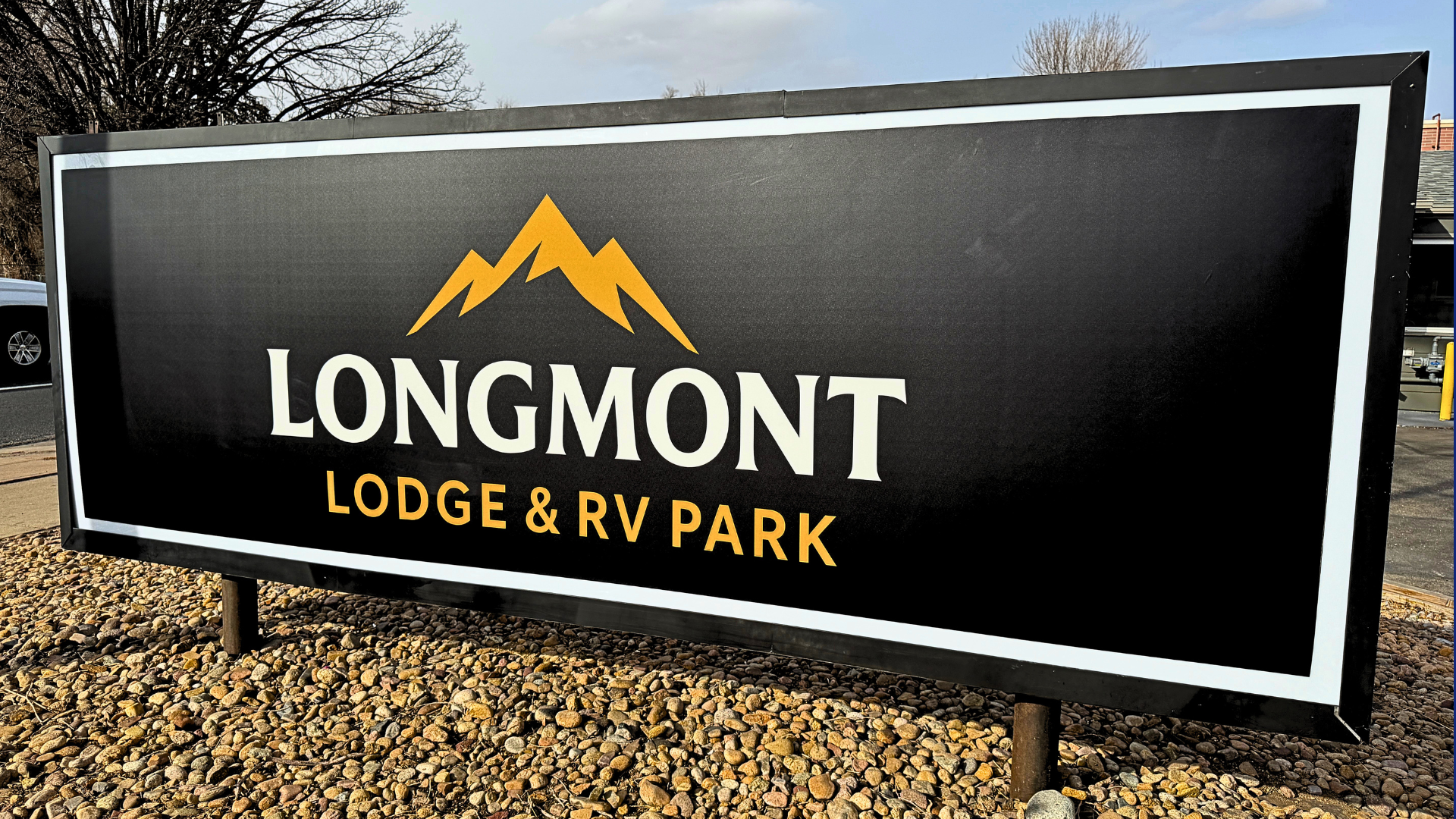 Custom monument sign installed at Longmont Lodge & RV Park in Colorado, showcasing professional commercial sign design, fabrication, permitting, and installation.