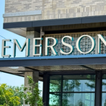 Illuminated channel letter building sign installed on a modern commercial office building in Denver, Colorado, providing high visibility and professional branding.