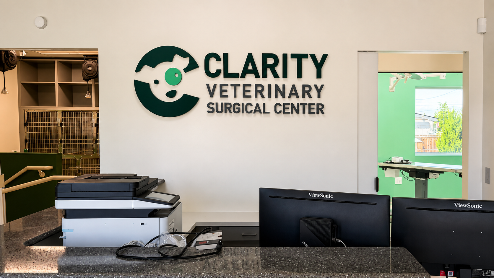 Dimensional Clarity Veterinary Surgical Center logo and lettering installed behind a modern reception desk.
