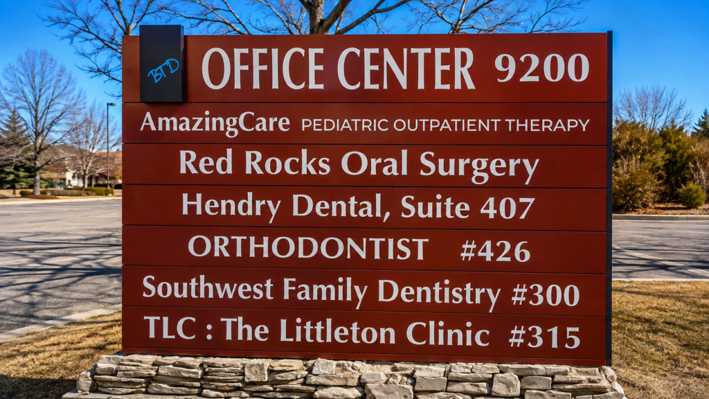 Freestanding monument directory sign identifying businesses at Office Center 9200