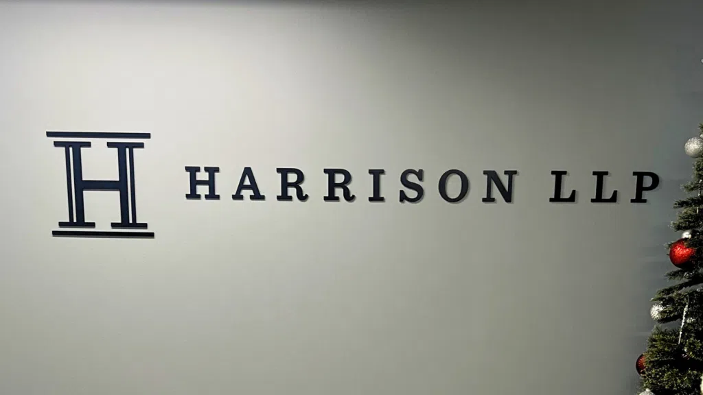 Harrison LLP dimensional logo and lettering displayed on a law firm reception wall
